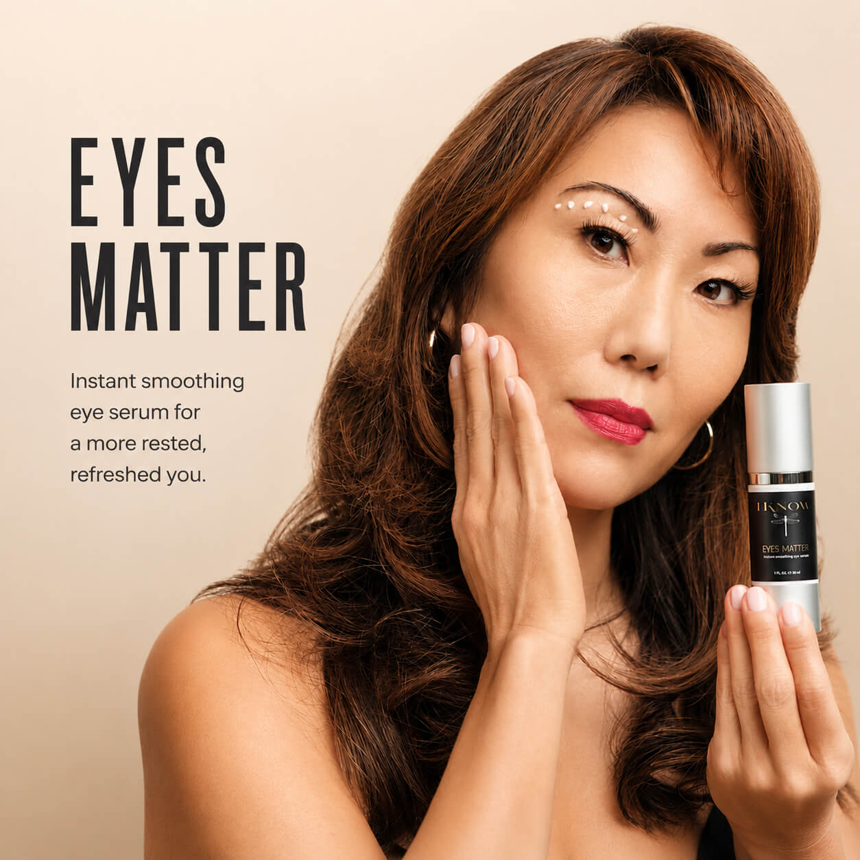 Woman holding a skincare product with &