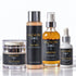 Four skincare products from IKnow Cosmetics arranged on a reflective white surface against a white background: a jar of Very Necessary SPF 40 moisturizing cream, a bottle of Me First exfoliating powder cleanser, a bottle of Immerse pure neroli budget aromatic inhaler, and a dropper bottle of Cellular Retain 100% pure & natural plant serum.