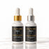 Two skincare dropper bottles from IKnow Cosmetics on a white marble surface against a white background. The left bottle is &