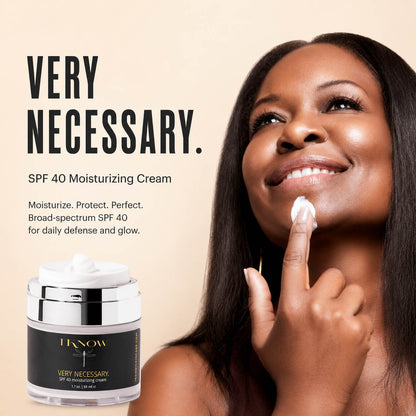 Woman applying cream to her face with &